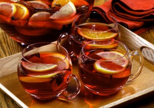 Mulled wine in punch bowl and glass cups